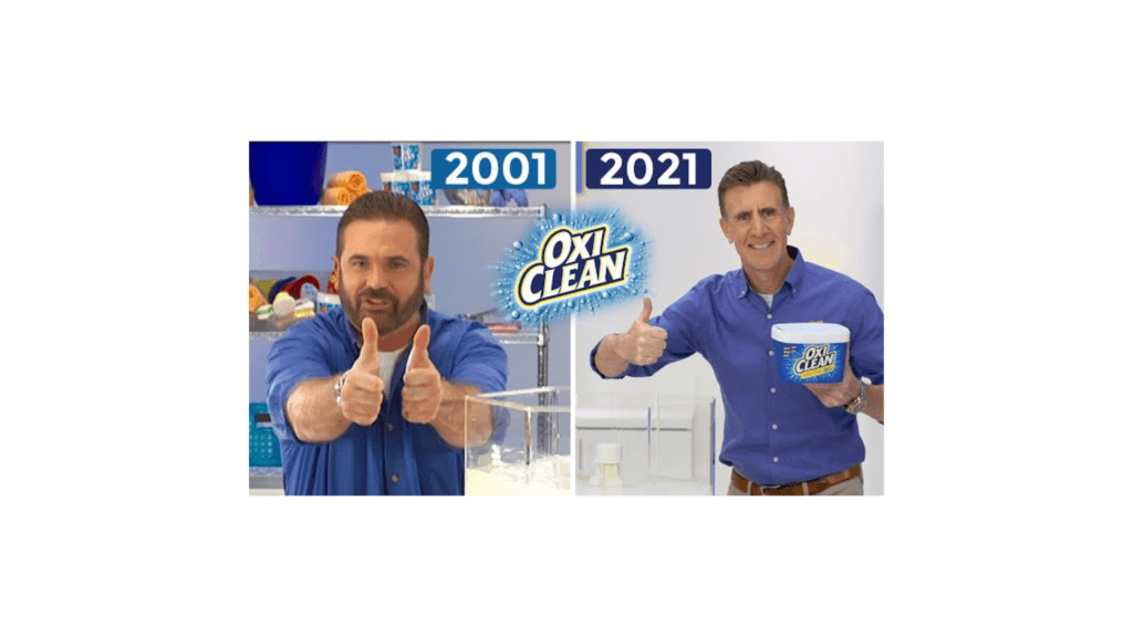 The 2001 and 2021 spokesmen for OxiClean side by side holding the product